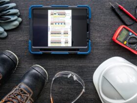 Composition with digital tablet and electrician work items.