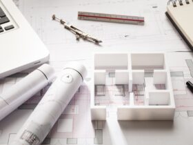 Construction concept. Residential building drawings and house model,