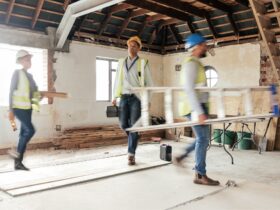 Construction worker, busy and team working building development, maintenance and property upgrade t
