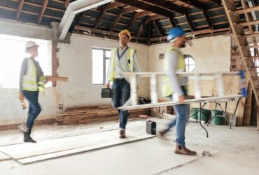 Construction worker, busy and team working building development, maintenance and property upgrade t