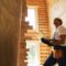 Construction worker with laptop providing house examination