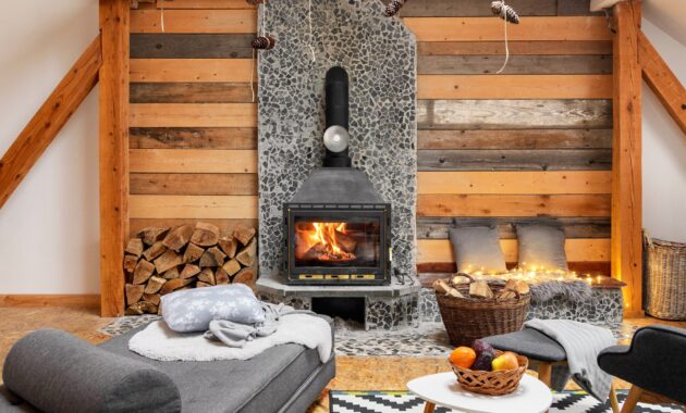 Cozy cabin interior with fireplace and beautiful furniture.