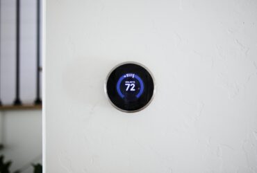 Digital modern thermostat at home