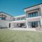 House, property and elderly couple on a balcony, relax and bonding at their dream home. Real estate
