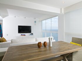 Interior of apartment, living room overlooking the sea.