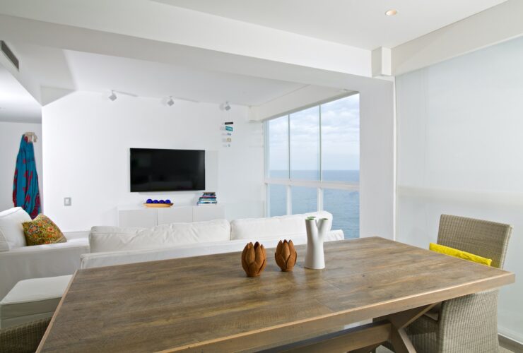 Interior of apartment, living room overlooking the sea.