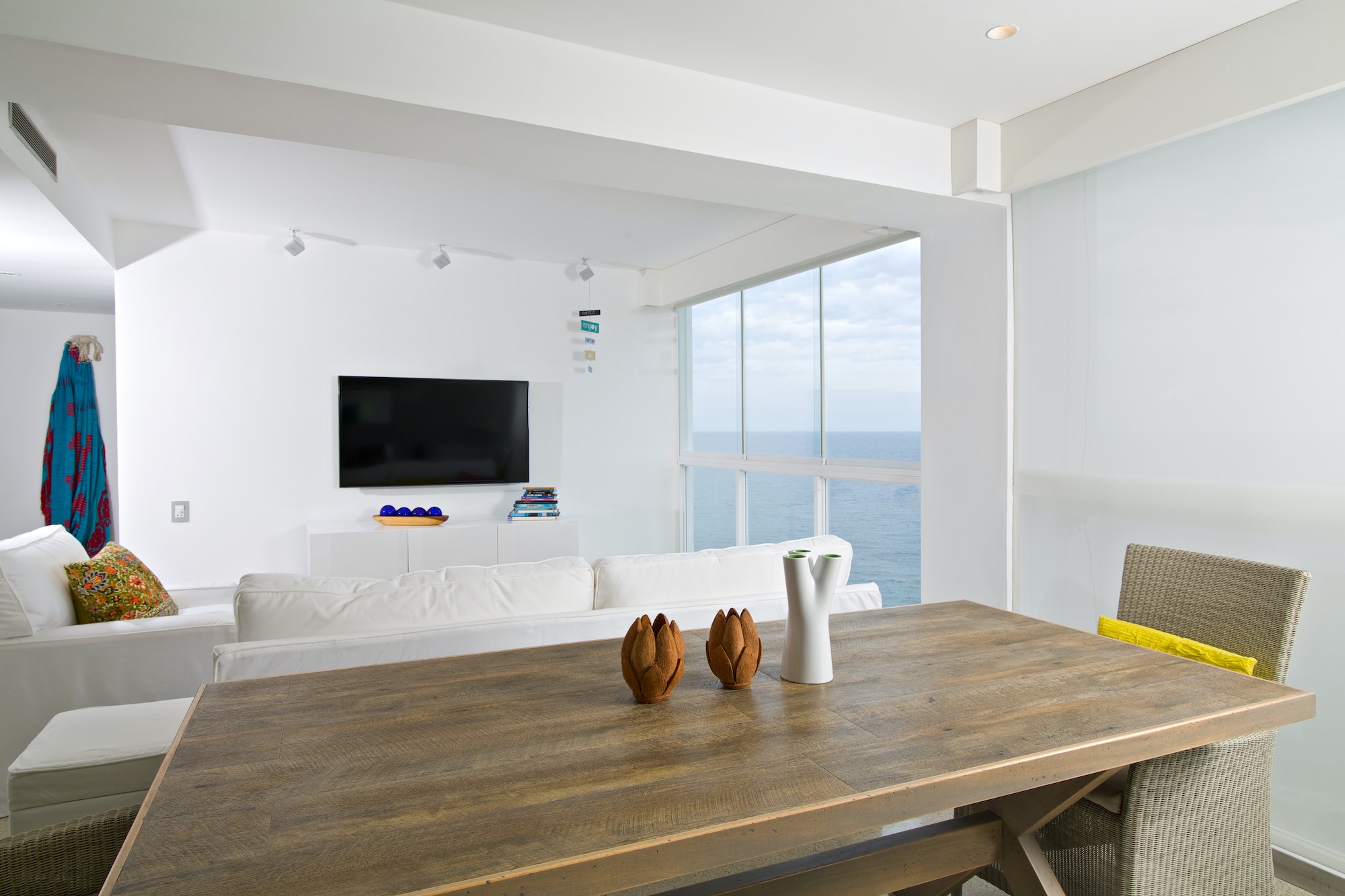 Interior of apartment, living room overlooking the sea.