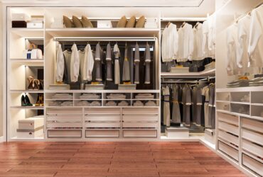 luxury wood walk in closet with wardrobe and wood floor