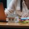 Real estate woman with house model on working desk for investment to buying property