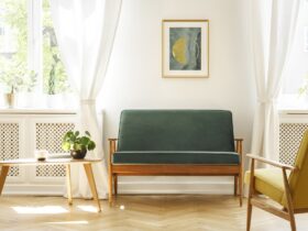 Real photo of a mid-century living room interior with a sofa, co