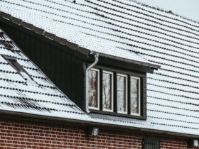 Roof of a house covered by snow in winter