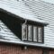 Roof of a house covered by snow in winter