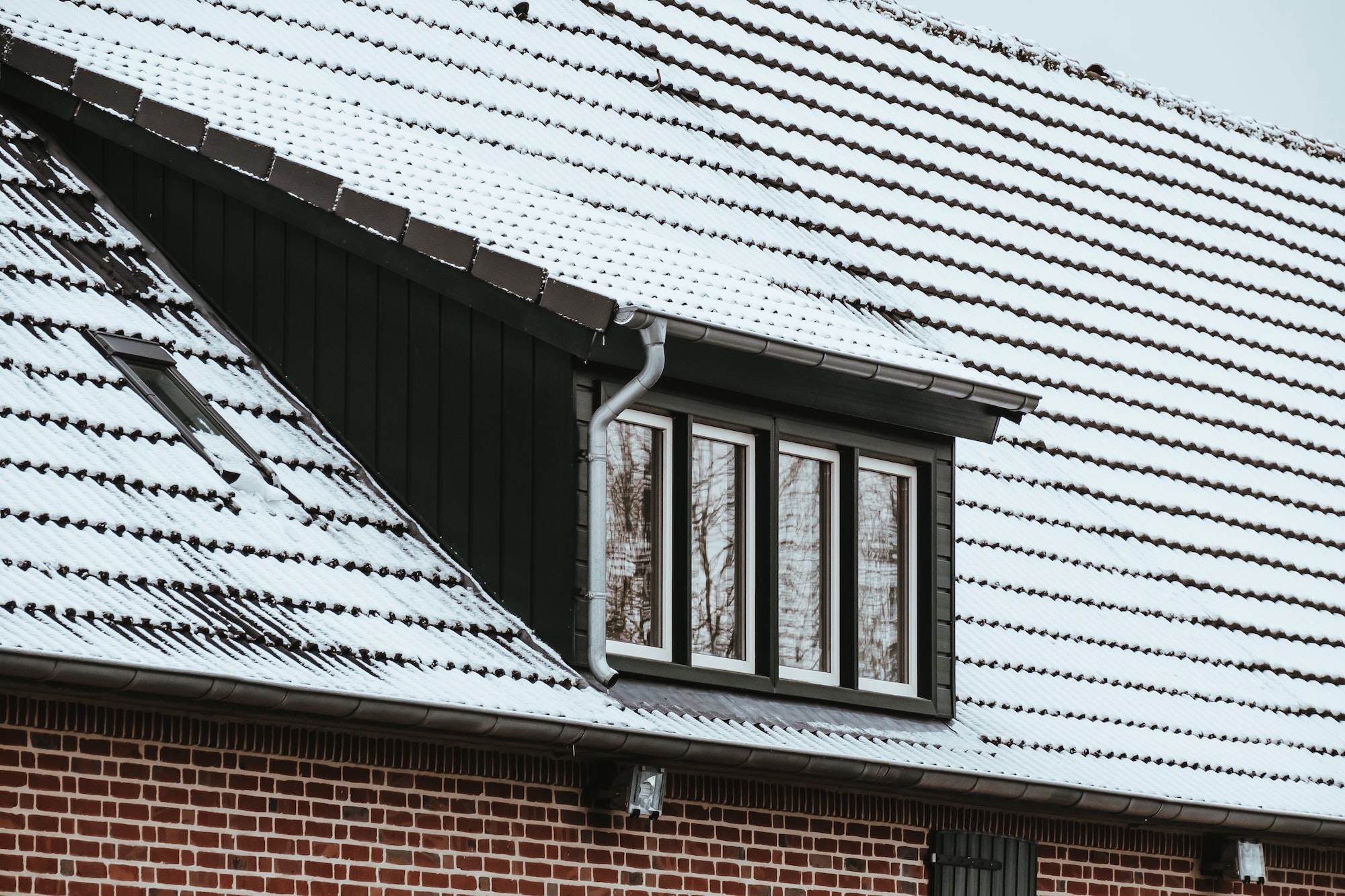 Roof of a house covered by snow in winter