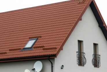 Roof of a new house made from yellow roofing tiles