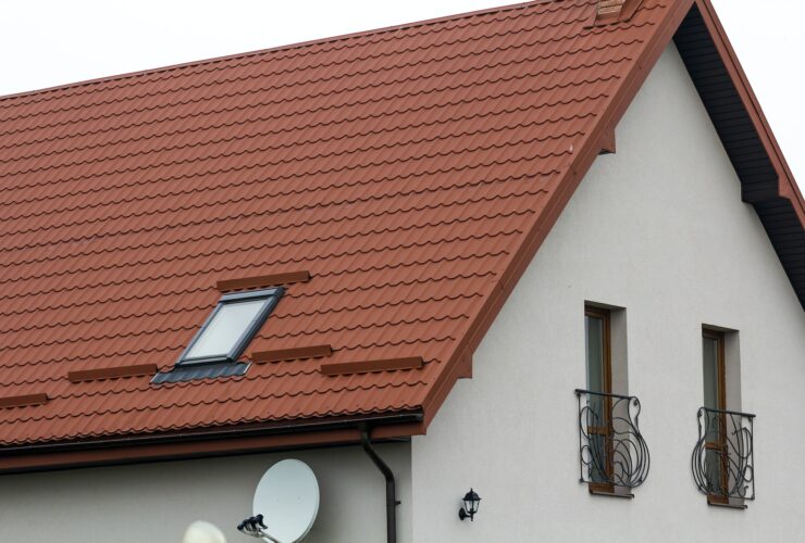 Roof of a new house made from yellow roofing tiles