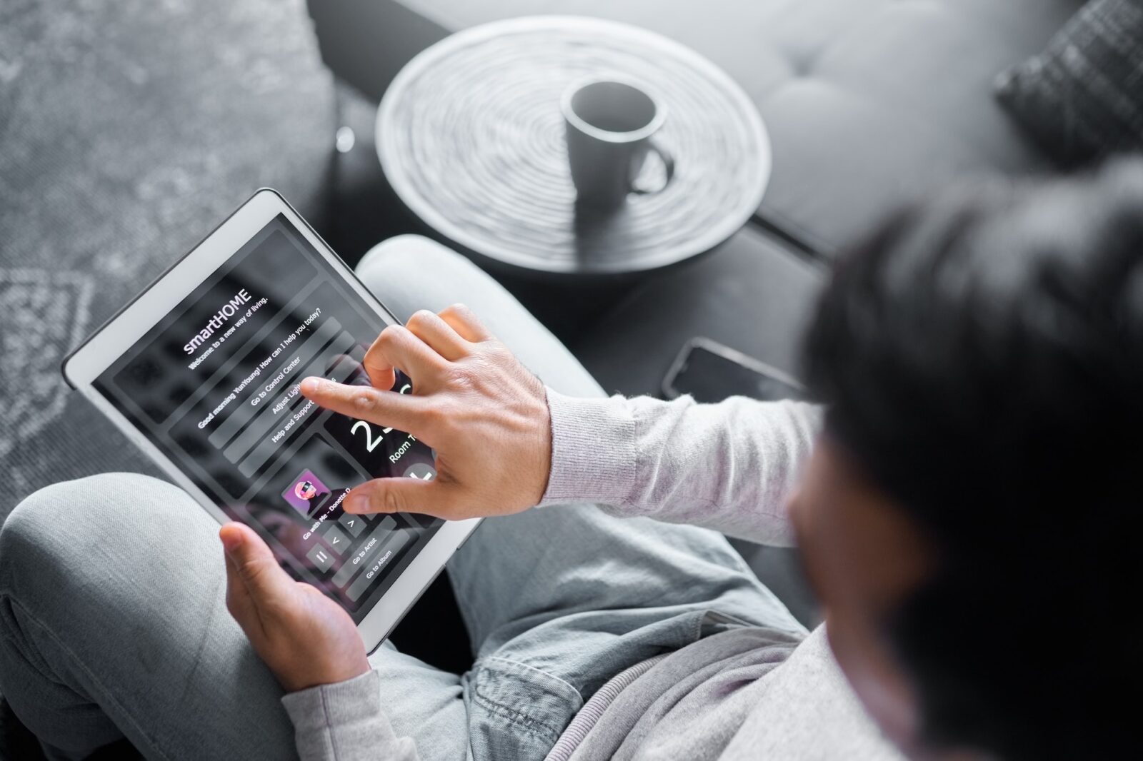 Tablet, sofa or man with smart home system for air conditioning, safety security network or house a
