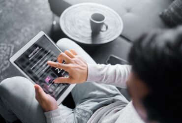 Tablet, sofa or man with smart home system for air conditioning, safety security network or house a