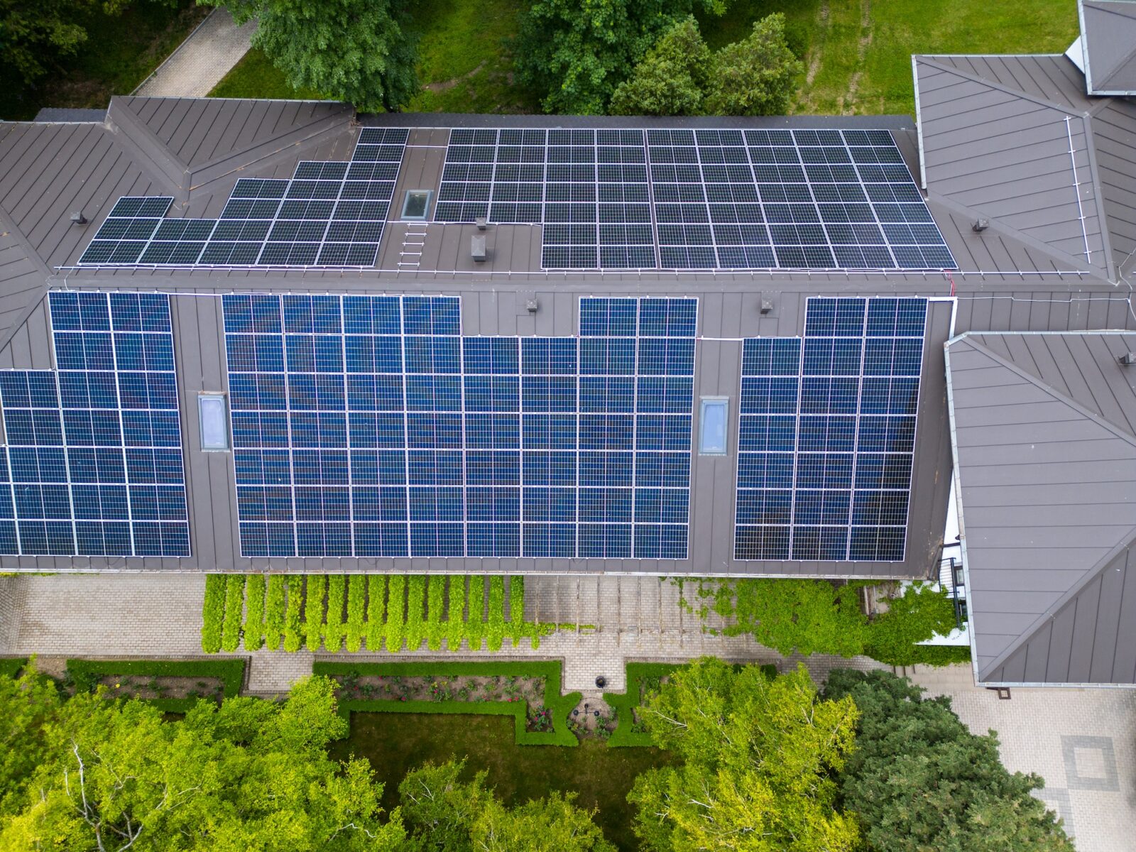 The modern house with a roof designed as a large solar panel, blending style and sustainability. Its