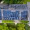 The modern house with a roof designed as a large solar panel, blending style and sustainability. Its