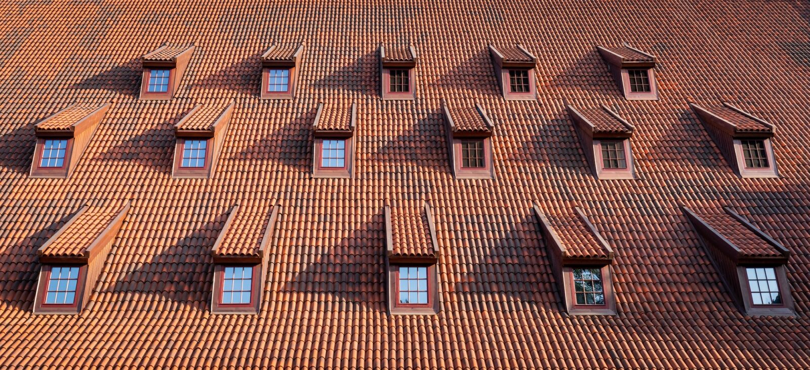 Traditional roof with windows covered by ceramic tiles