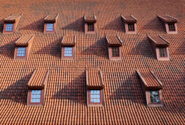 Traditional roof with windows covered by ceramic tiles