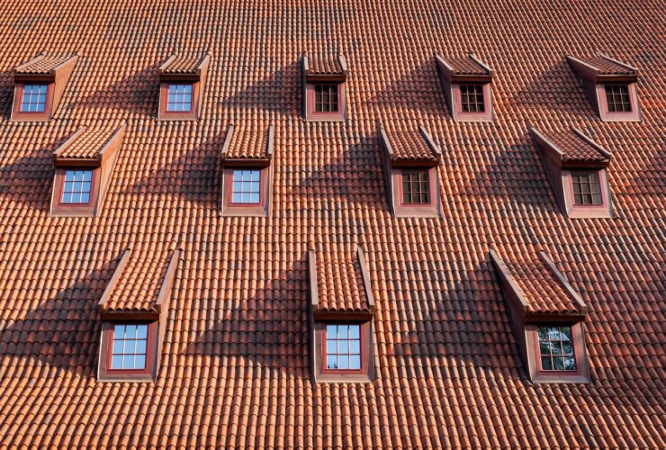Traditional roof with windows covered by ceramic tiles