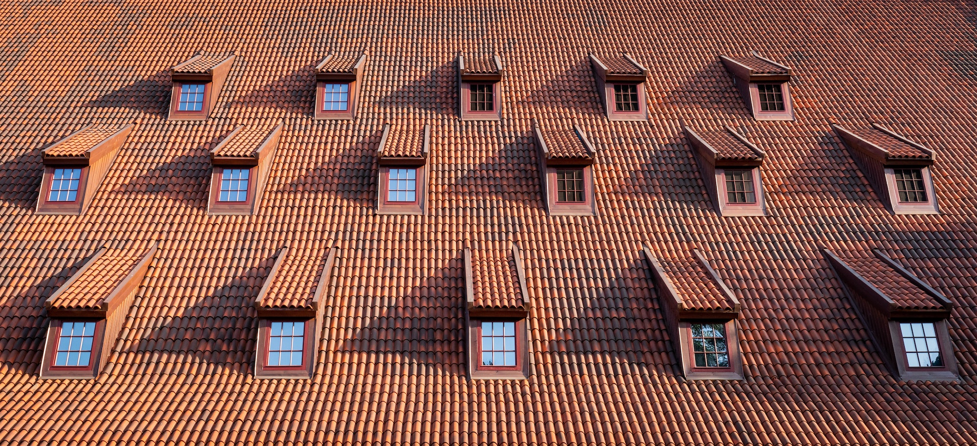 Traditional roof with windows covered by ceramic tiles