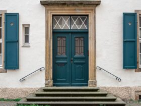 Vintage old doors and windows on the facade of the house.