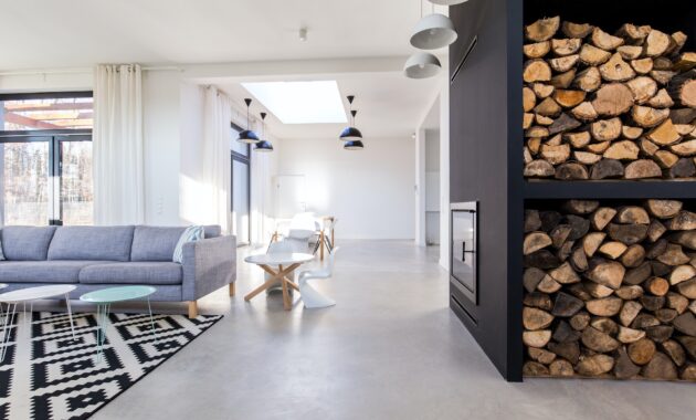 White living room in modern minimalist house with concrete floor