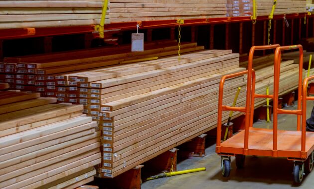 Wood stacked on shelving inside a lumber yard concept, construction of houses