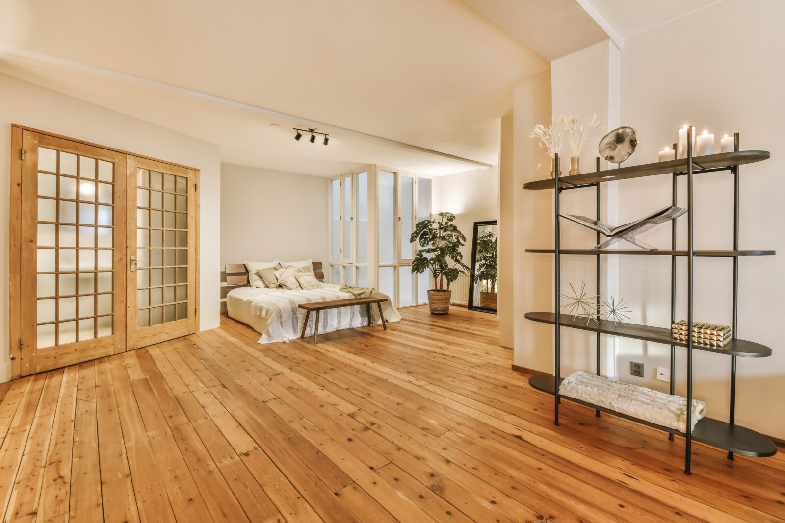 A luxurious huge bedroom with a wooden floor