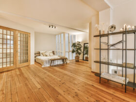 A luxurious huge bedroom with a wooden floor