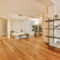 A luxurious huge bedroom with a wooden floor