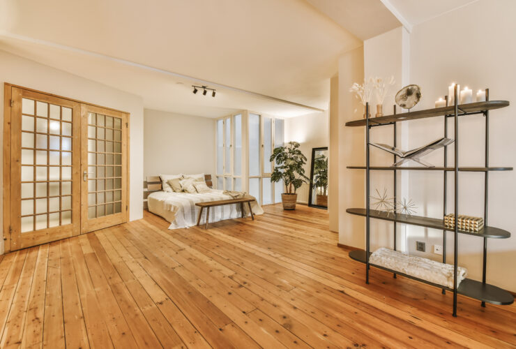 A luxurious huge bedroom with a wooden floor