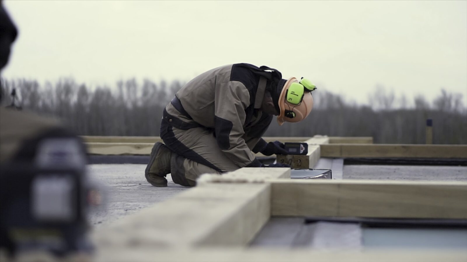 A Worker In Special Protective Uniform Leveling A 2022 12 13 06 40 43 Utc