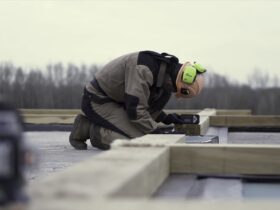 A Worker In Special Protective Uniform Leveling A 2022 12 13 06 40 43 Utc
