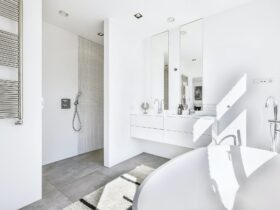 Bright white master bathroom with tub