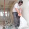 Builder Collecting Construction Debris In A Bag A 2022 08 16 22 34 23 Utc