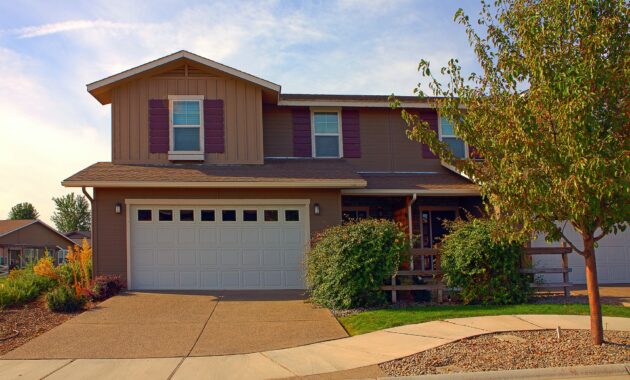 House and driveway in suburban neighborhood