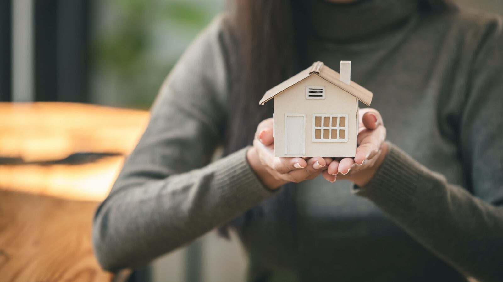 Real estate agent with house plans in hand