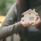Real estate agent with house plans in hand