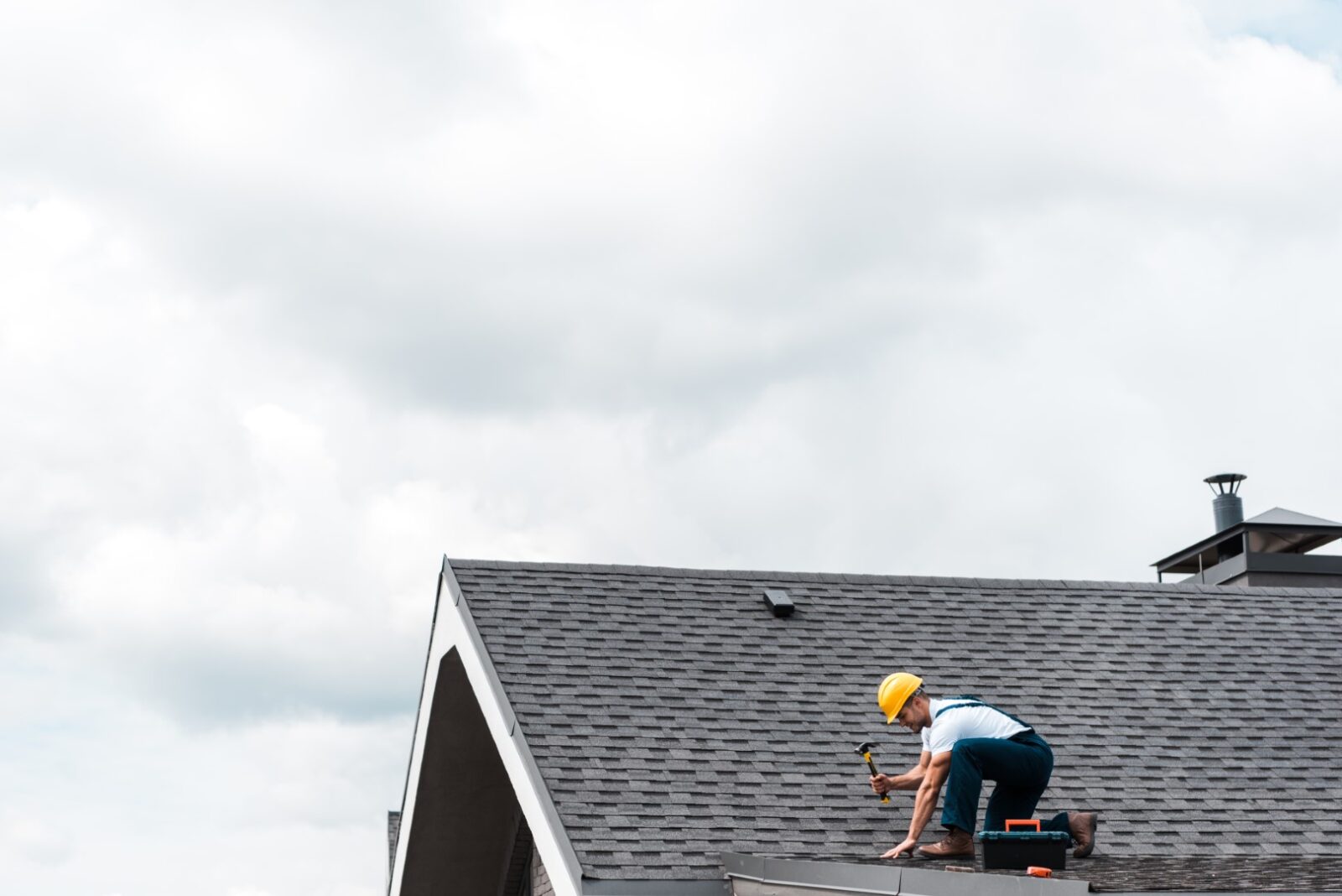Repairman In Helmet Holding Hammer While Repairing 2022 12 16 19 56 00 Utc