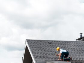 Repairman In Helmet Holding Hammer While Repairing 2022 12 16 19 56 00 Utc