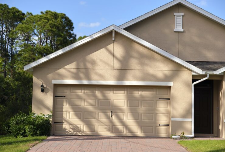 Wide garage double door and concrete driveway of new modern american house