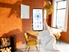 Woman Holding Phone With Running Smart Home Applic 2022 04 24 23 52 03 Utc
