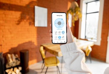 Woman Holding Phone With Running Smart Home Applic 2022 04 24 23 52 03 Utc