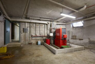 Basement With Red Heating Boiler In Old House Inte 2021 08 26 22 35 04 Utc