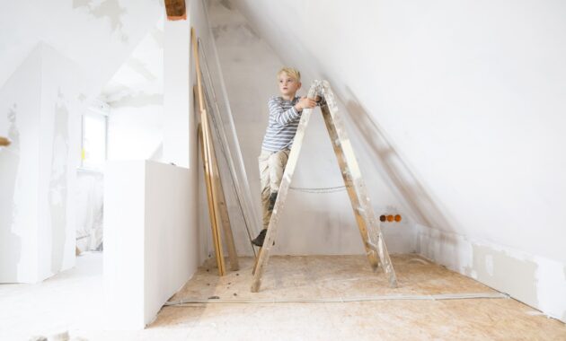 Boy Standing On Ladder In Attic To Be Renovated 2022 12 16 22 13 10 Utc