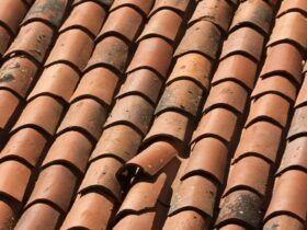 Closeup Shot Of A Red Tiled Roof With A Damaged Su 2022 12 31 04 16 53 Utc