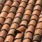 Closeup Shot Of A Red Tiled Roof With A Damaged Su 2022 12 31 04 16 53 Utc